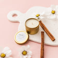 Load image into Gallery viewer, a candle and some cinnamon sticks on a tray