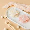 Load image into Gallery viewer, a white tray topped with three different types of soap