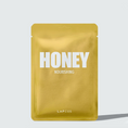 Load image into Gallery viewer, a packet of honey nourishing on a white background