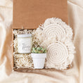 Load image into Gallery viewer, a box with a potted plant and a candle