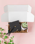 Load image into Gallery viewer, a graduation cap and a plant in a box
