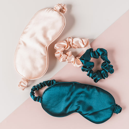 a satin bag and two scrunffles on a pink and blue background