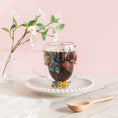 Load image into Gallery viewer, a cup of hot chocolate with flowers in it
