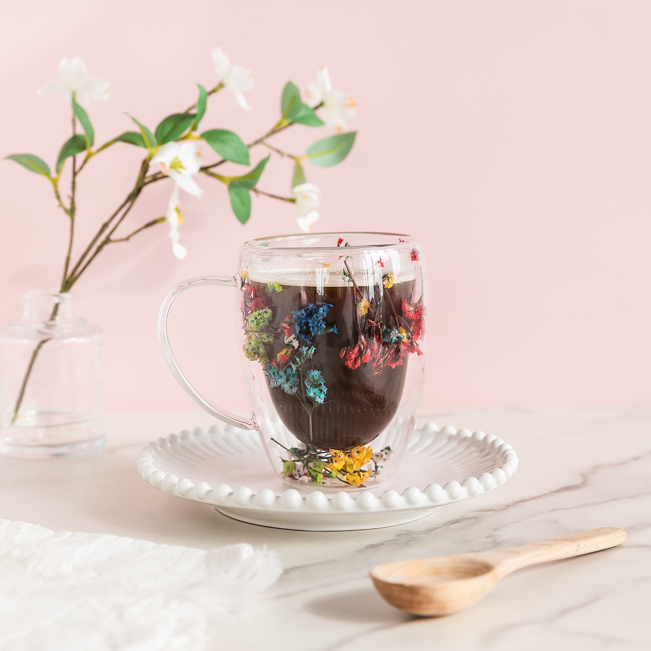 a cup of hot chocolate with flowers in it