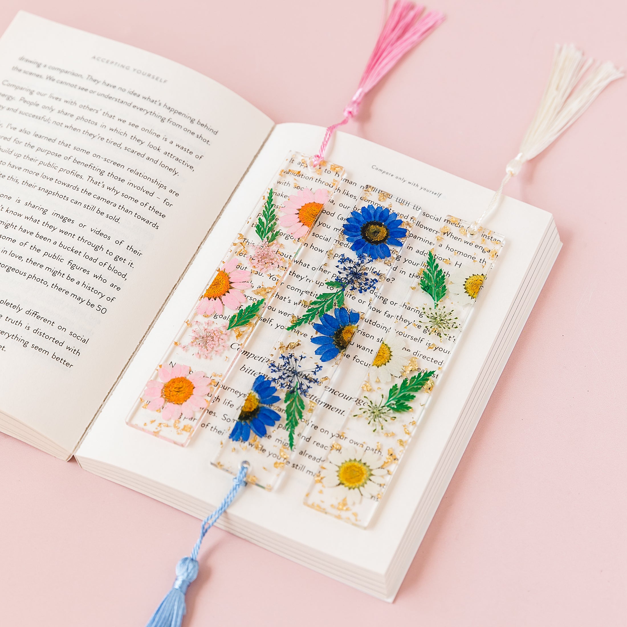 a book with a bookmark made out of flowers