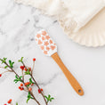Load image into Gallery viewer, a wooden spatula sitting on top of a marble counter
